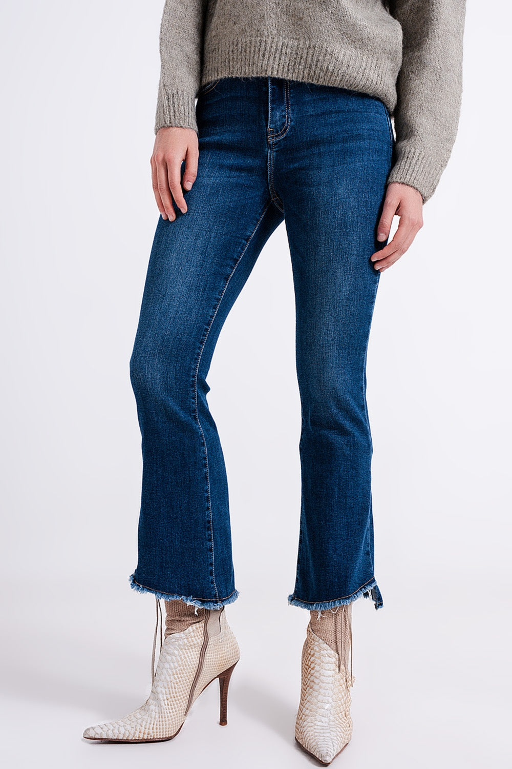 High-waist jeans with asymmetric hem