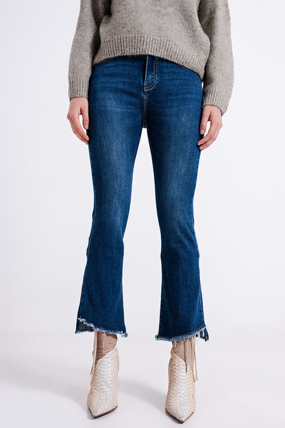 High-waist jeans with asymmetric hem