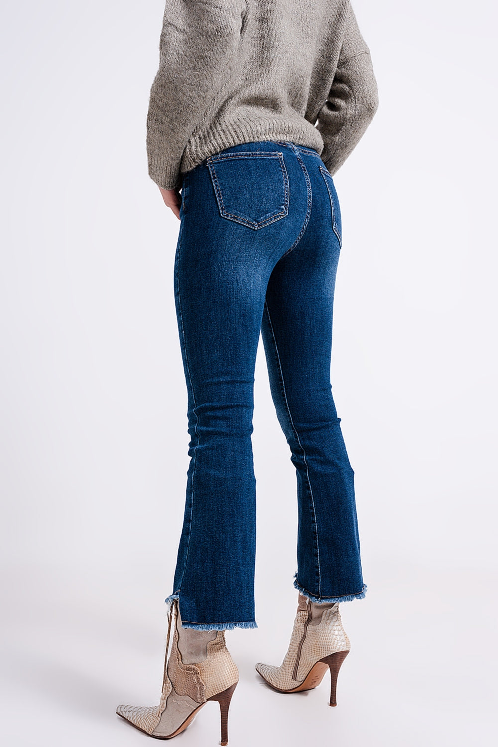 High-waist jeans with asymmetric hem